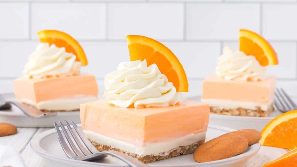 Three slices of the orange creamsicle dream bars.