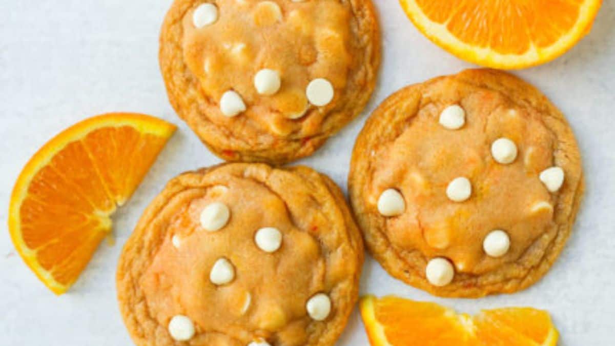 A few pieces of orange white chocolate chip cookies.