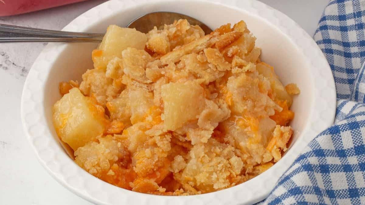 A bowl of Paula Deen's pineapple casserole with cheese