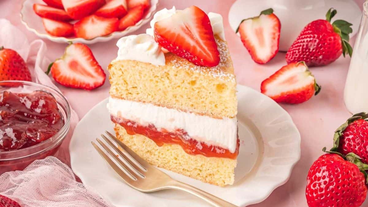 A slice of Victoria strawberry sponge cake.