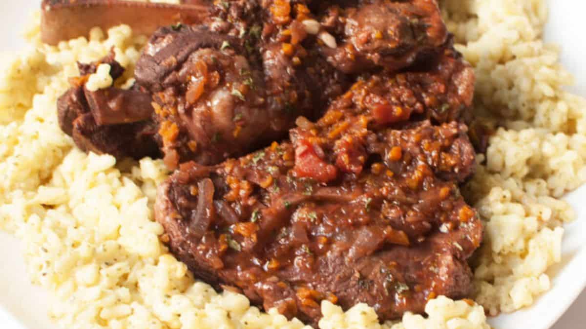 A serving of agnello brasato on a plate. 