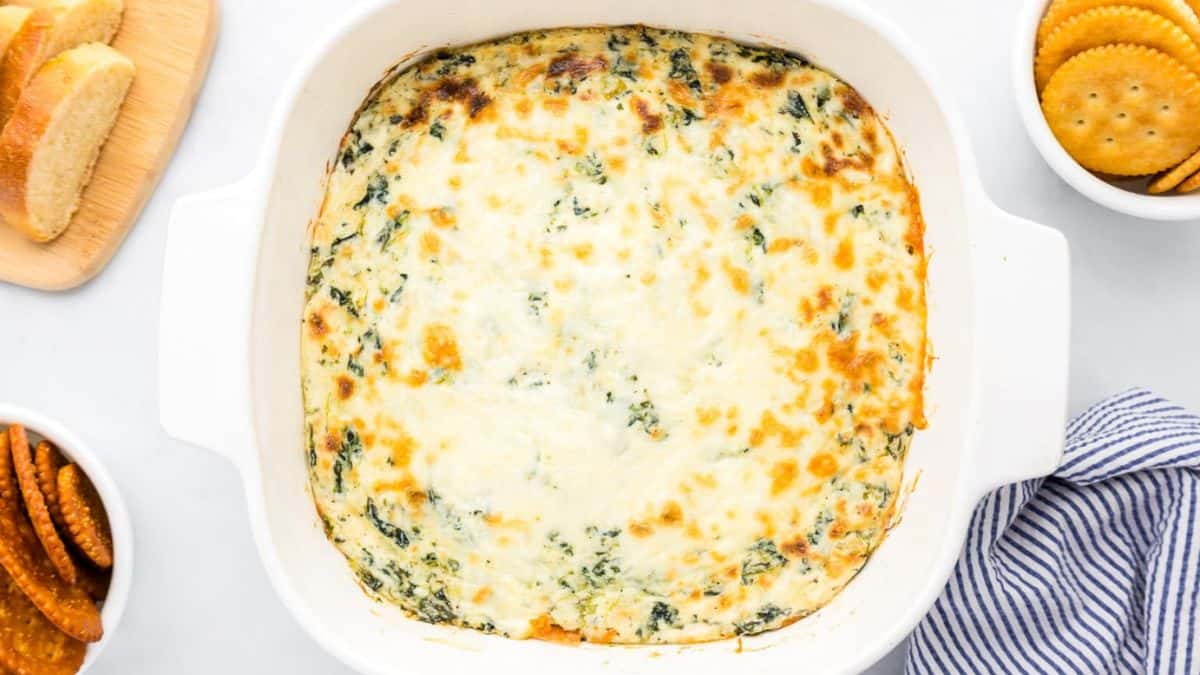 Baked spinach dip, served in a baking dish. 
