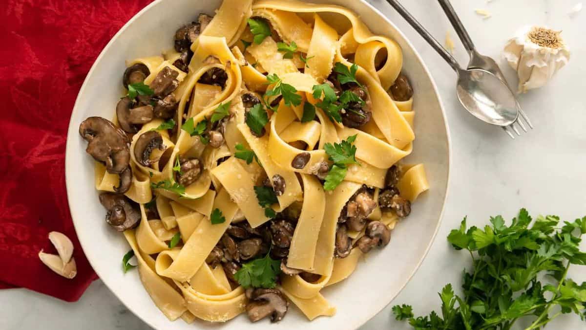 Creamy mushroom pappardelle served on a plate.