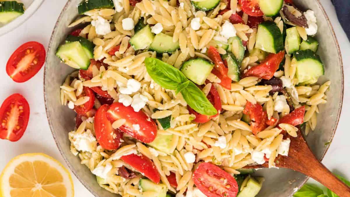 A bowl of pesto orzo pasta salad