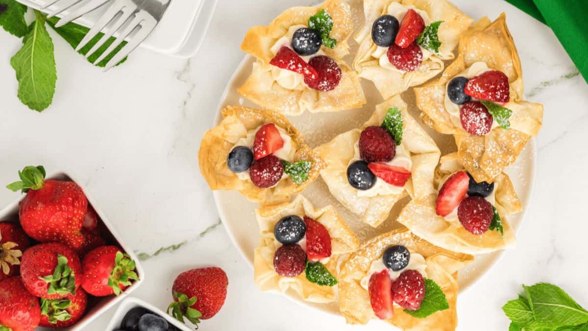Strawberry Phyllo Cheesecake Cups served on a plate.  