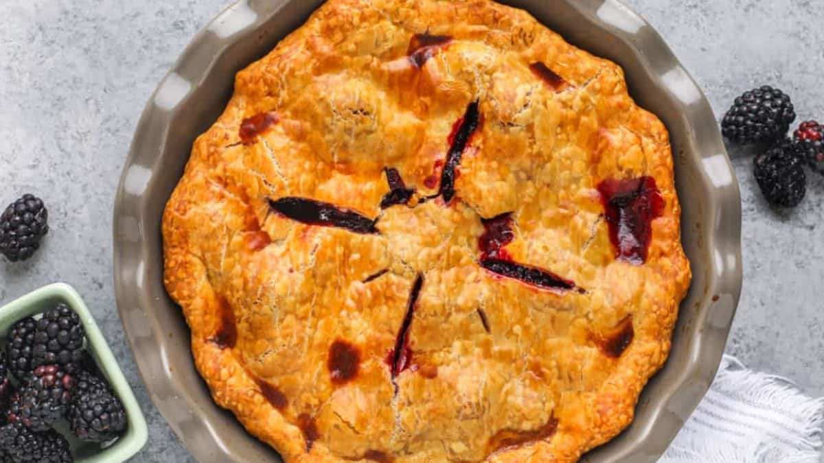 A whole pie of homemade blackberry pie. 