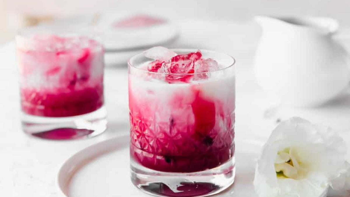 A serving of homemade iced beetroot latte with coconut milk. 