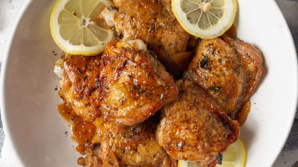 A serving of honey garlic lemon pepper chicken thighs on a plate. 