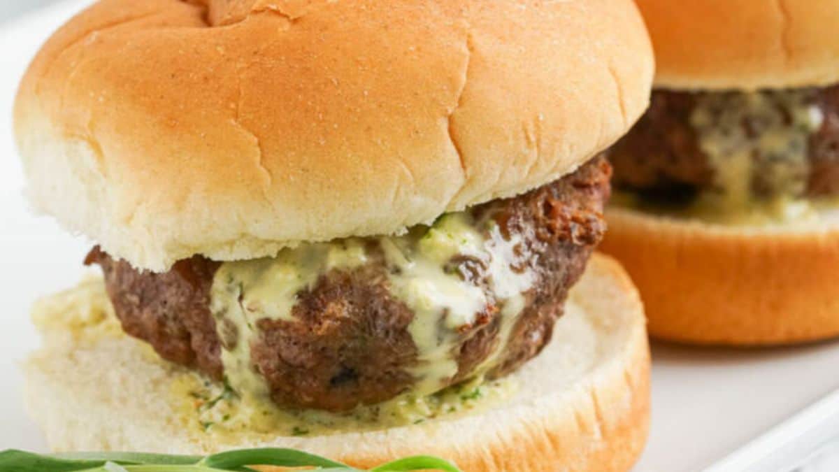 Kobe Beef Sliders with Truffle B&eacute;arnaise served on a plate.