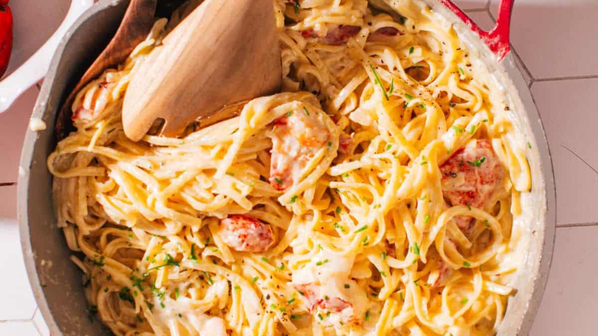 Lobster pasta with white wine cream sauce in a pot.