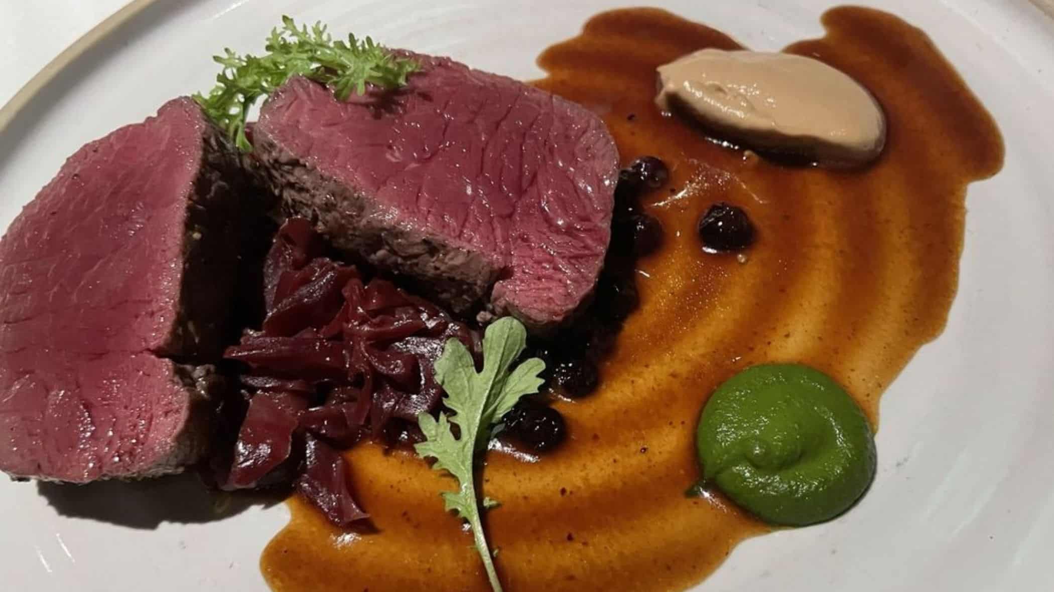 seared venison of wild mushrooms, braised red cabbage, bitter greens, huckleberry venison jus