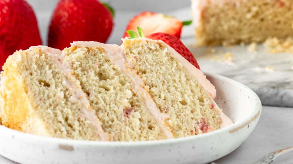 A slice of Strawberry Naked Cake served on a plate. 