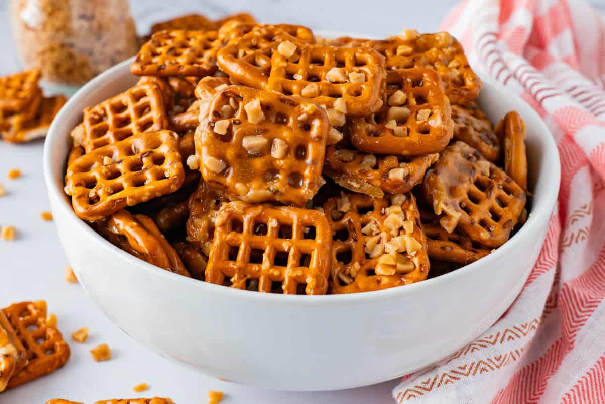 A serving bowl with butter toffee pretzels. 