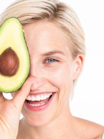 happy woman with avocado