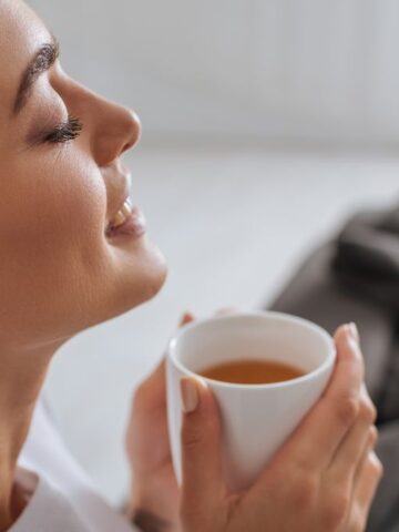 woman enjoying a hot cup of tea
