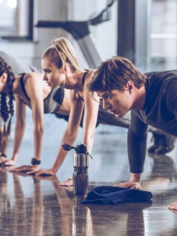 Sporty people exercising in gym