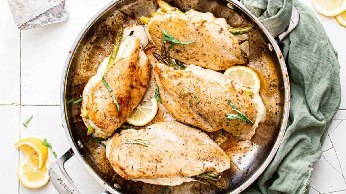 Asparagus Stuffed Chicken Breast in a pan.