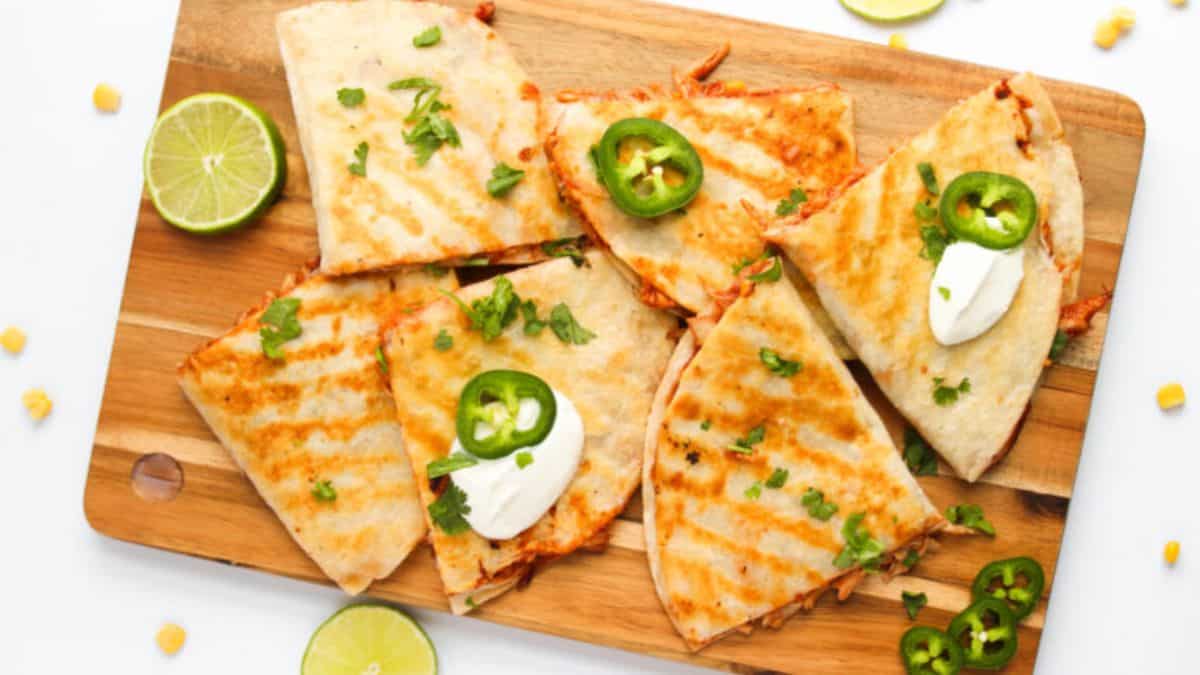 BBQ Chicken Quesadillas served on a board.