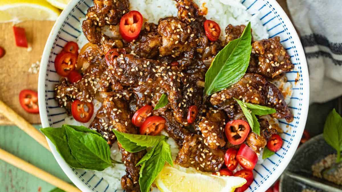 Crispy Chili Beef served on a bowl of rice. 