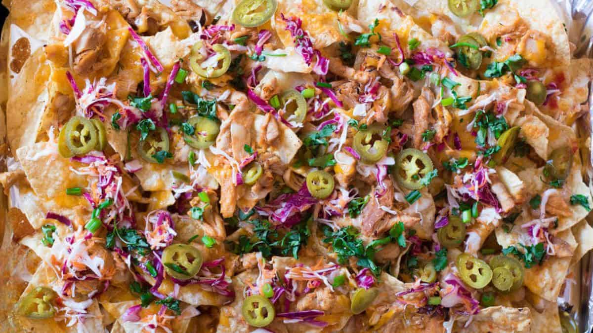 Firecracker Chicken Nachos on a baking pan. 