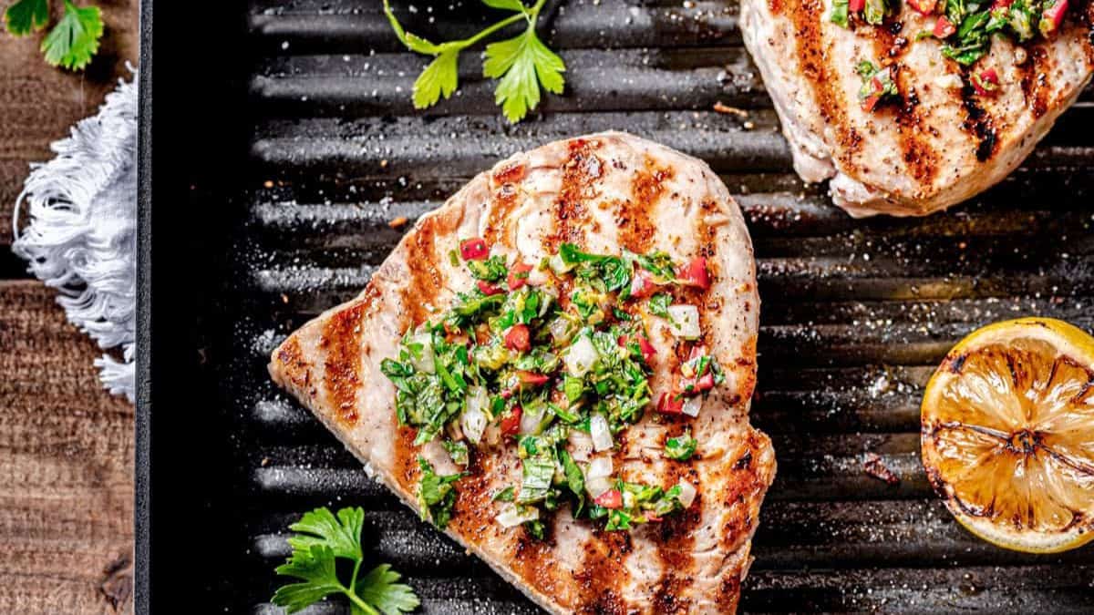 Grilled Swordfish with Summer Gremolata in a pan. 