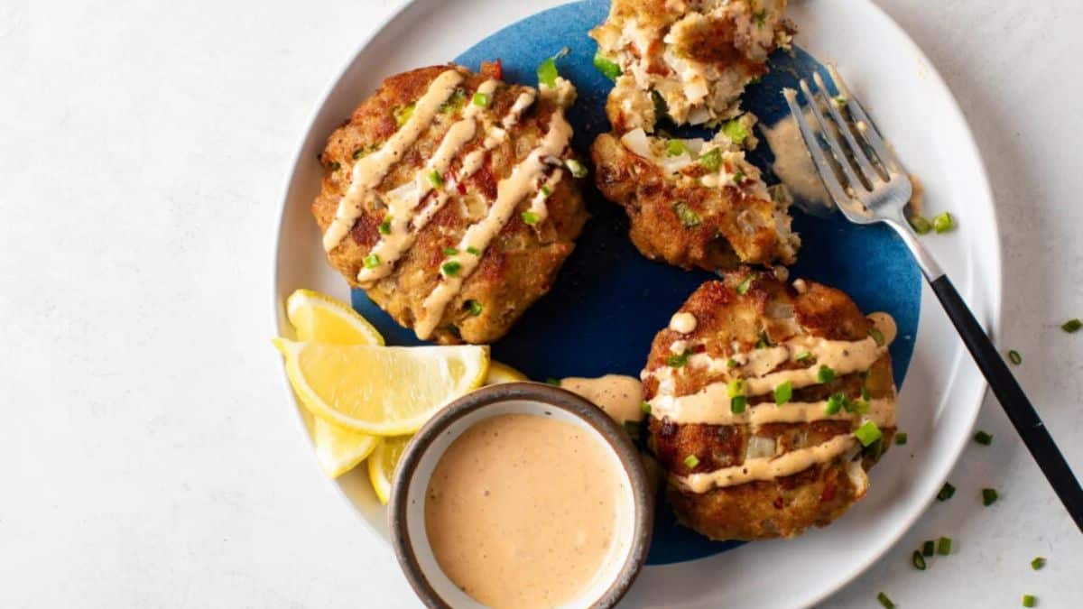 Salmon Croquettes served on a plate with a dip.