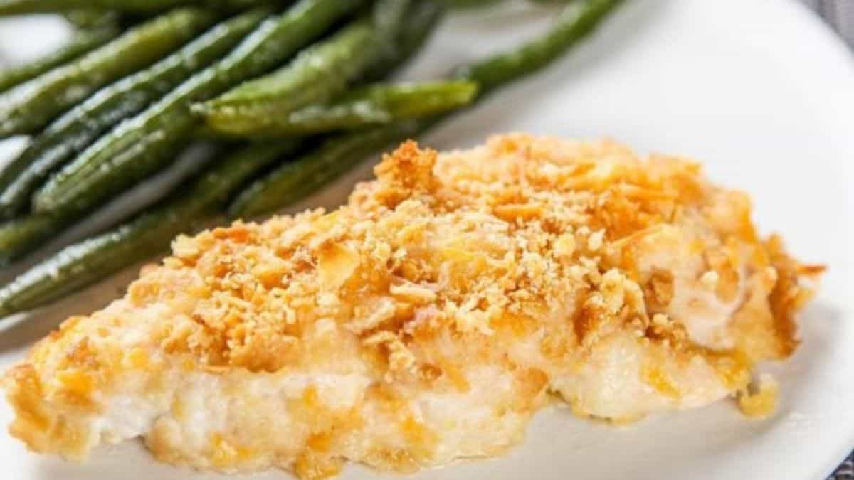 Ritz Cracker Chicken with string beans served on a plate.