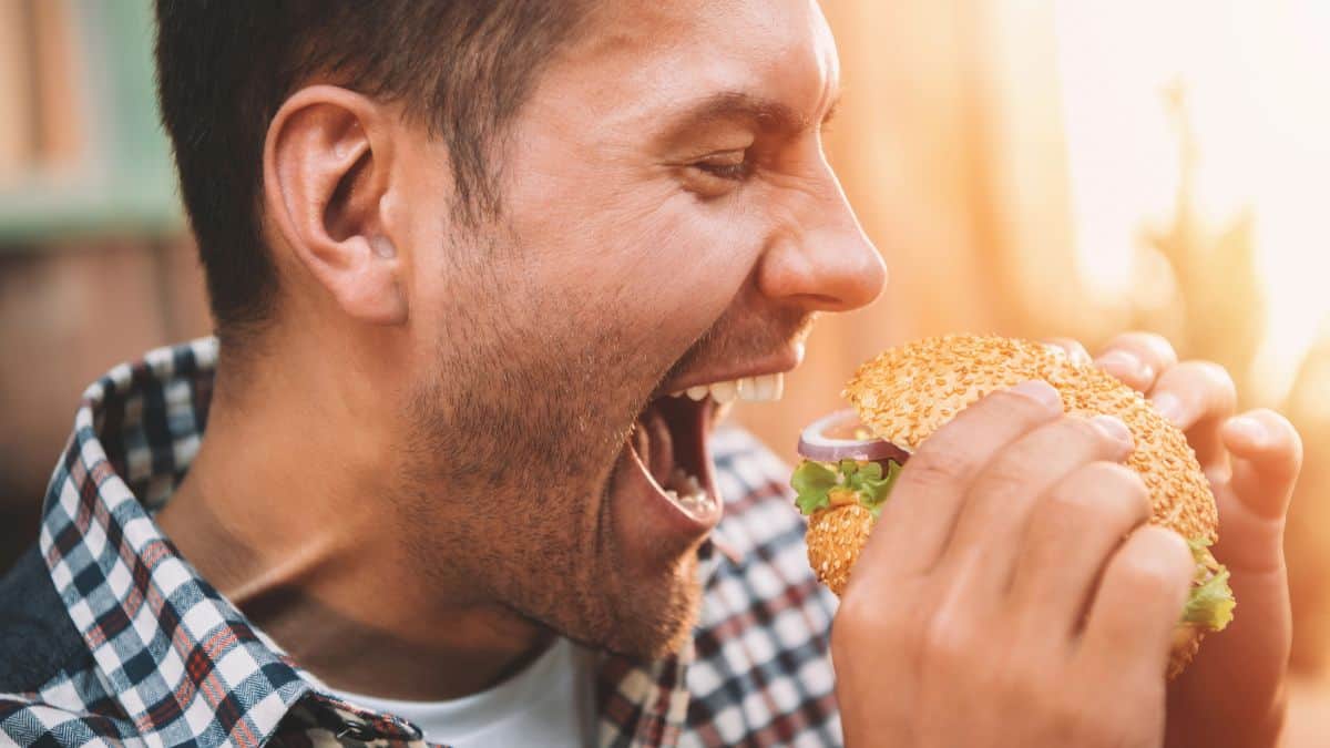 happy man eating a burger
