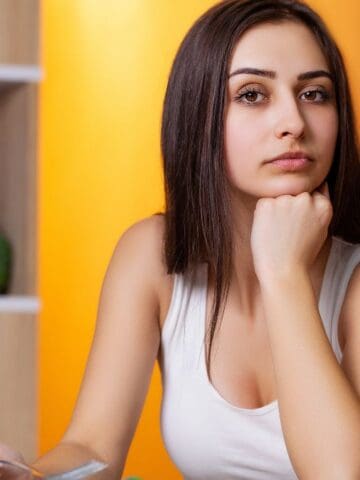 sad woman thinking about food