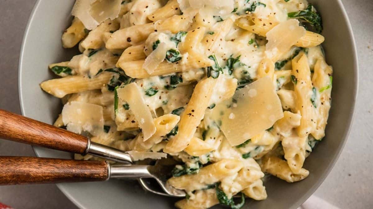 A serving of 30 Minute Creamy Chicken Spinach Pasta.