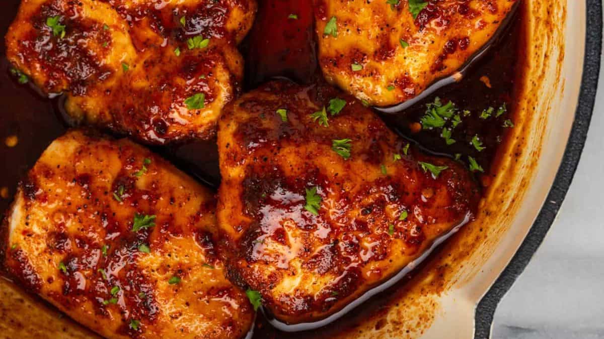 Baked Spicy Honey Chicken in a pan.