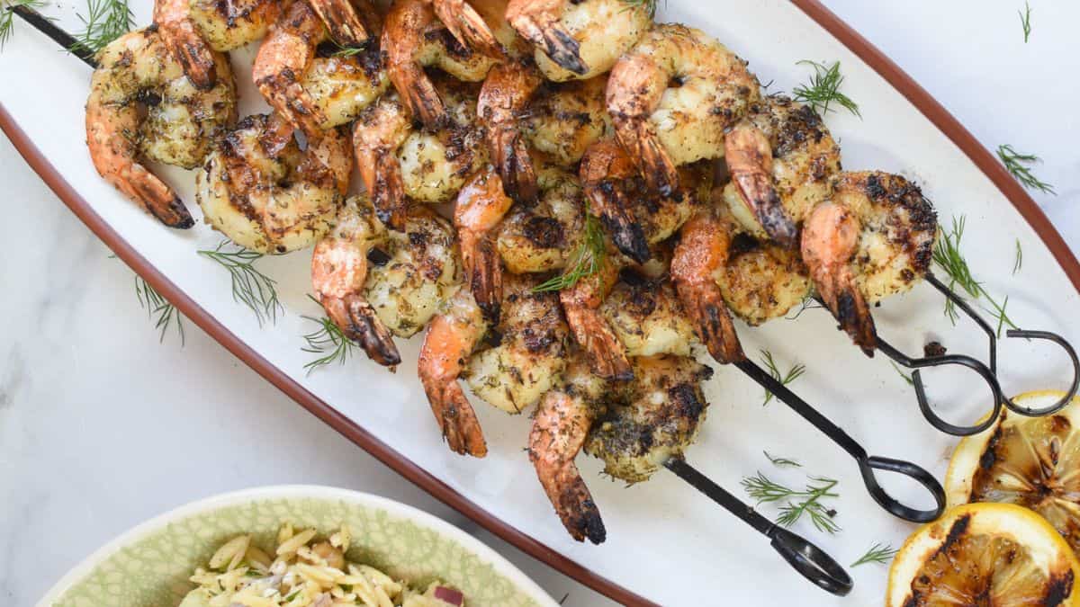 A few pieces of Greek Shrimp Marinade served on a plate. 