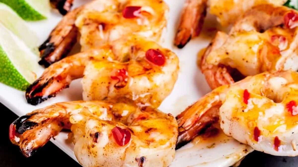 A few pieces of Grilled Shrimp Kabobs (Skewers) served on a plate.
