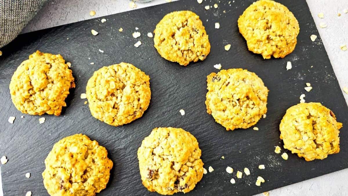 Freshly baked oatmeal raisin cookies with apple sauce
