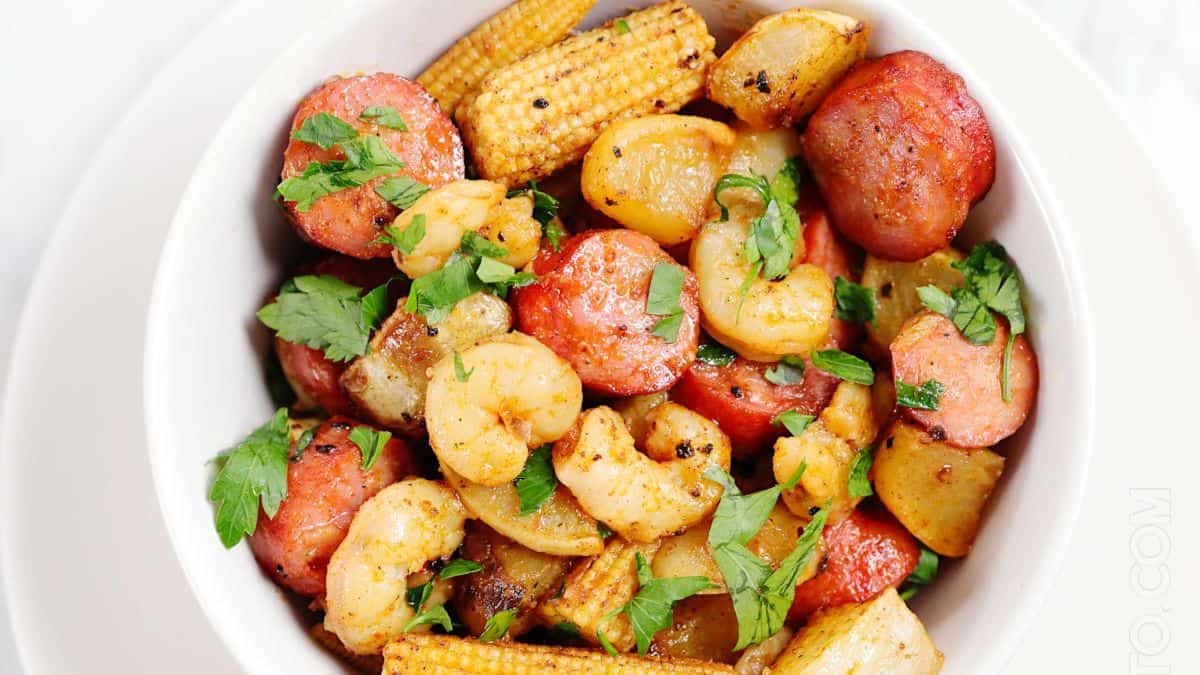 A serving of Sheet Pan Shrimp Boil in a bowl. 