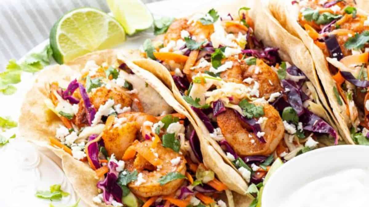 Few servings of Spicy Shrimp Tacos with Cilantro Lime Slaw on a plate.