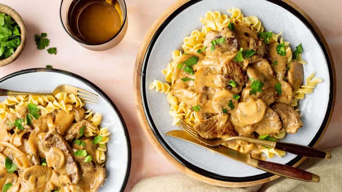 Servings of Steak Stroganoff with Buttered Noodles.