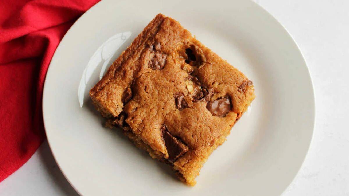 A serving of Candy Bar Blondies in a Sheet Pan.