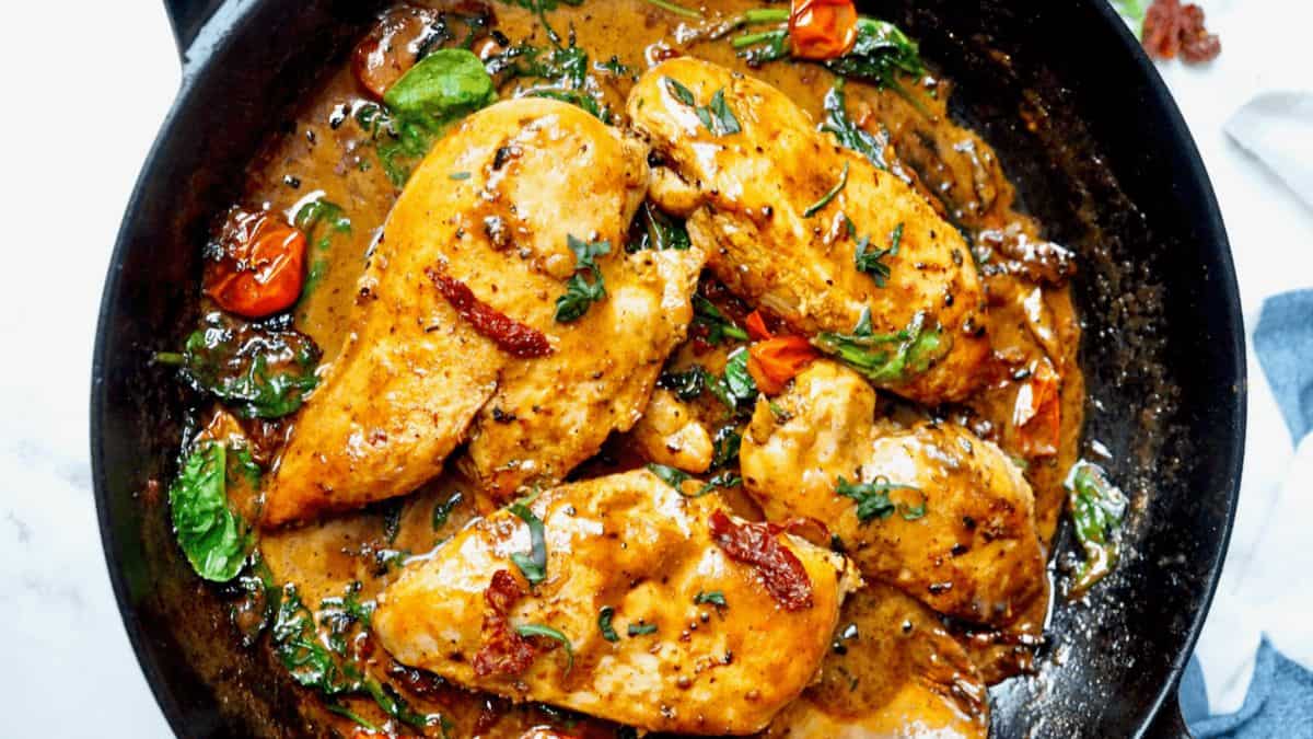 Tuscan Chicken in Parmesan Cream Sauce in a Pan.
