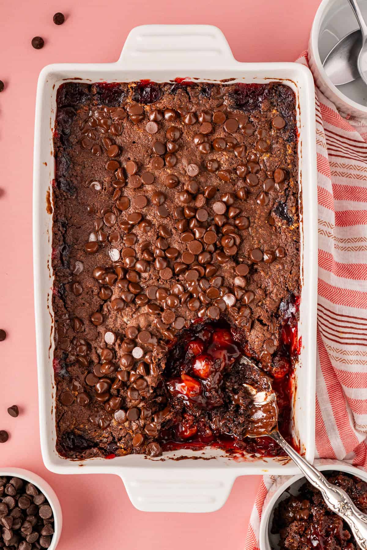 Chocolate Cherry Dump Cake in with serving spoon on it
