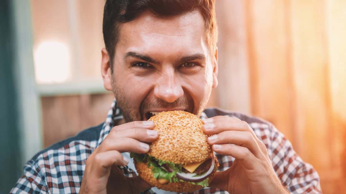 man eating burger