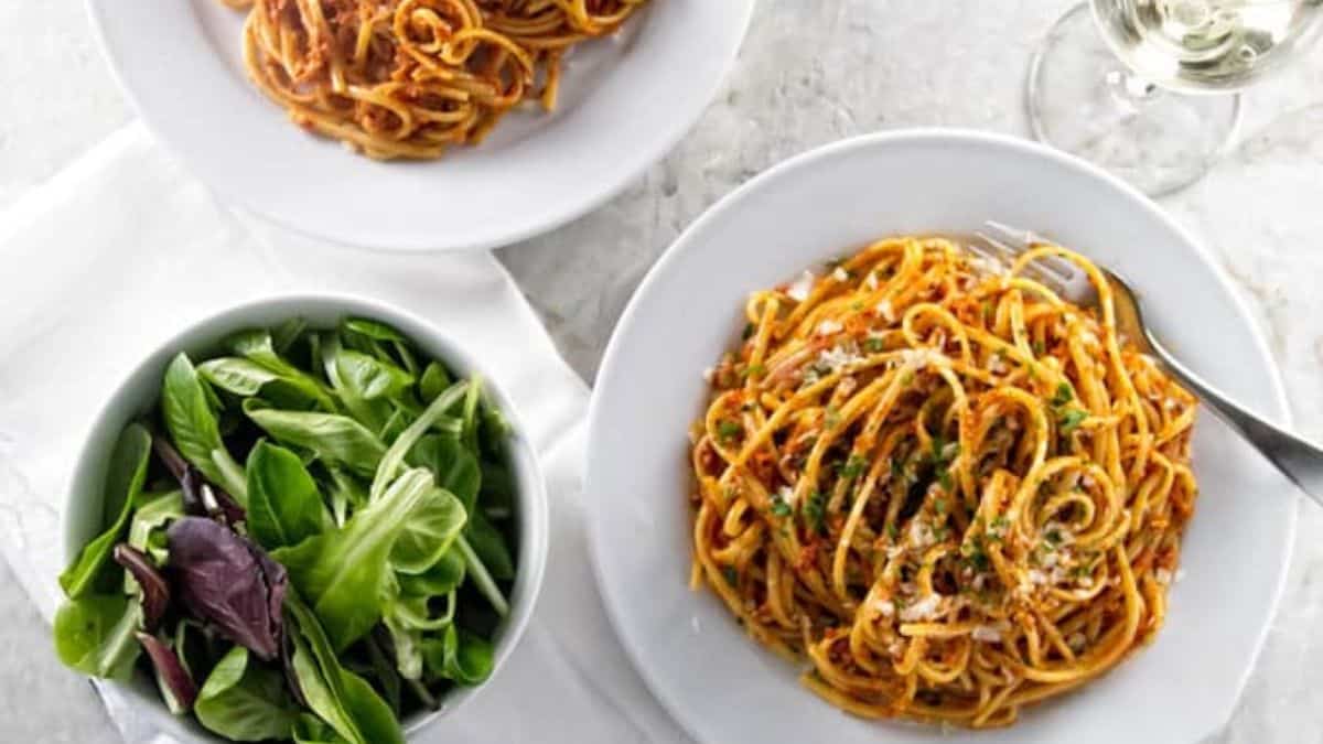 A couple of serving of Sun-Dried Tomato Pesto with salad on the side. 