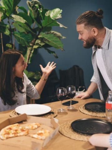 couple fighting over pizza