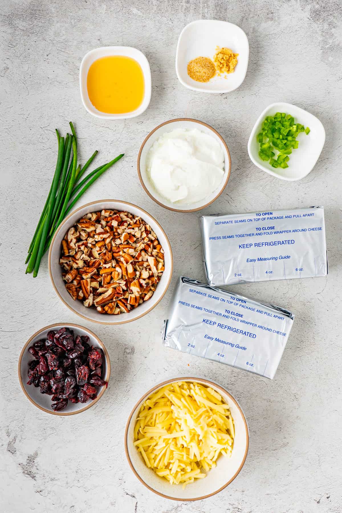 The ingredients to make Cranberry Pecan Cheese Ball