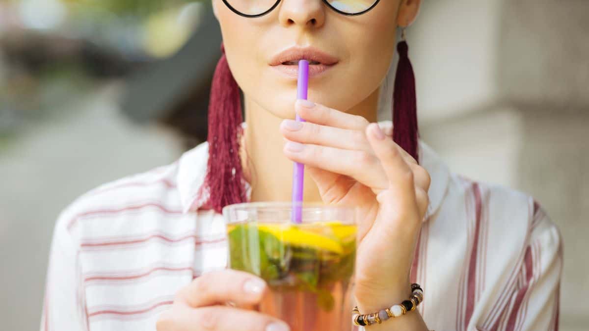 woman drinking cocktail