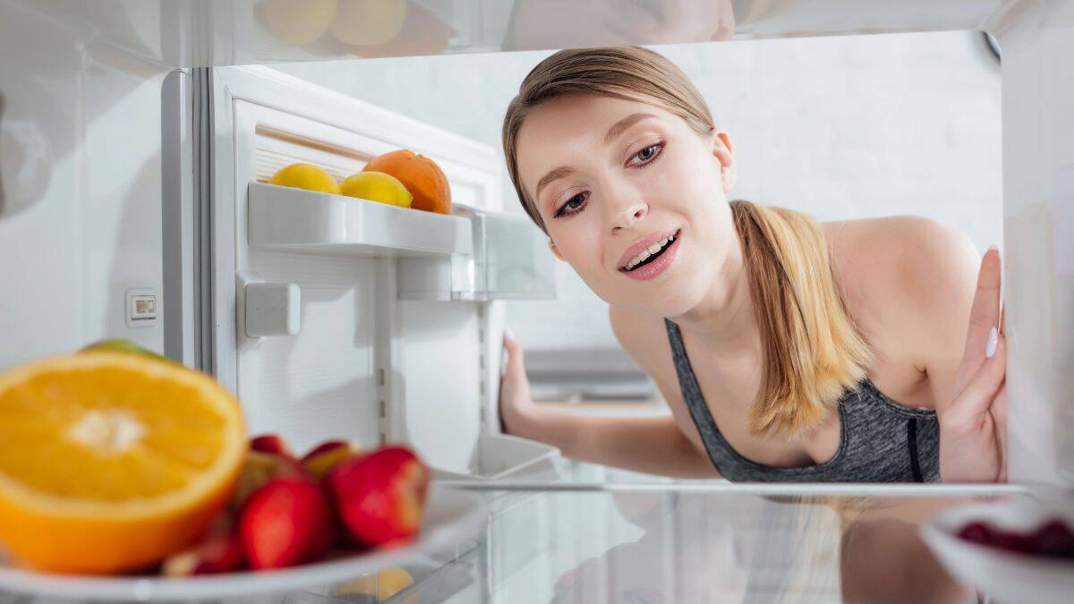 woman looking in the fridge