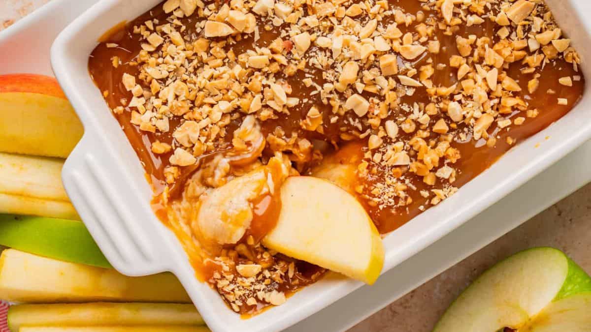 Caramel Apple Cream Cheese Dip with some sliced apples.