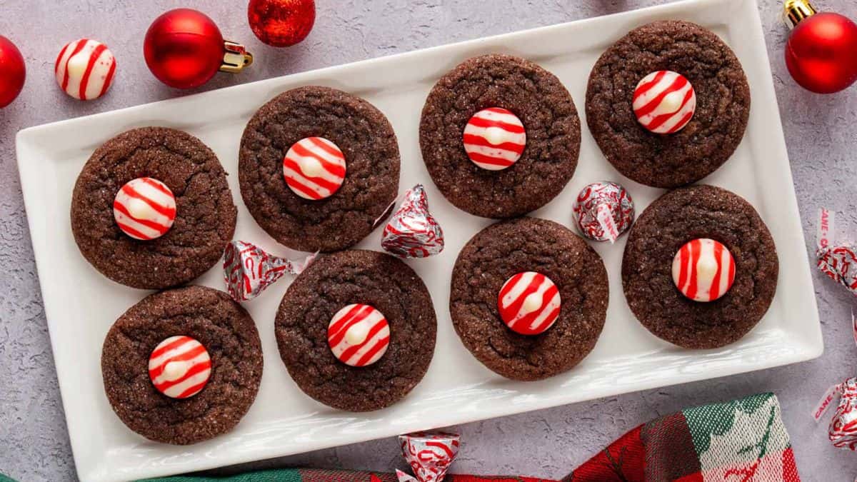 A couple of pieces of Chocolate Kiss Cookies With Hershey's Candy Cane Kisses.