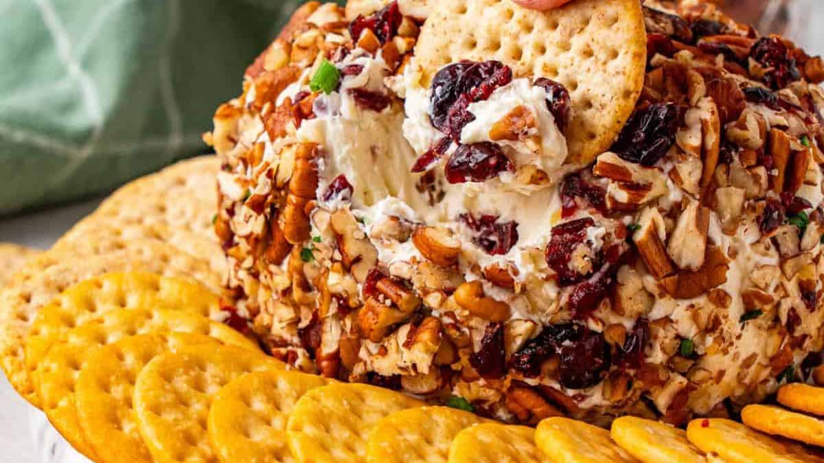 Cranberry Pecan Cheese Ball with side crackers.
