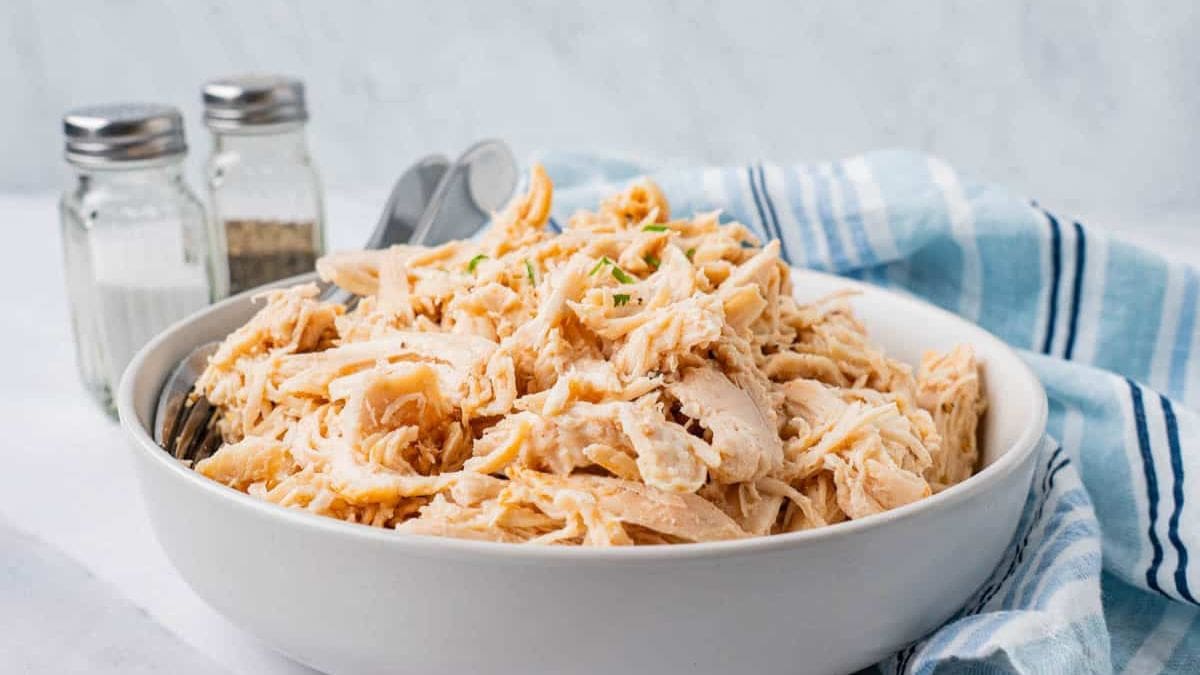 A bowl of Crockpot Shredded Chicken For Meal Prep.